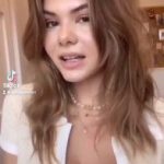 Kitty Lara plays with her big tits in black bra