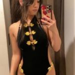 Caresses her Bigo feet on a yoga mat