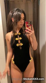 Caresses her Bigo feet on a yoga mat